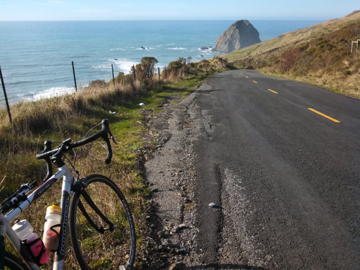 Bicycle on Mattole Road overlooking ocean and island